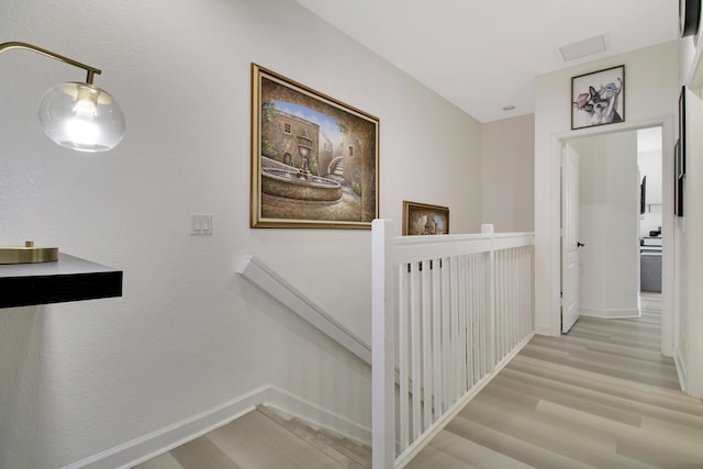 hall with light wood-type flooring
