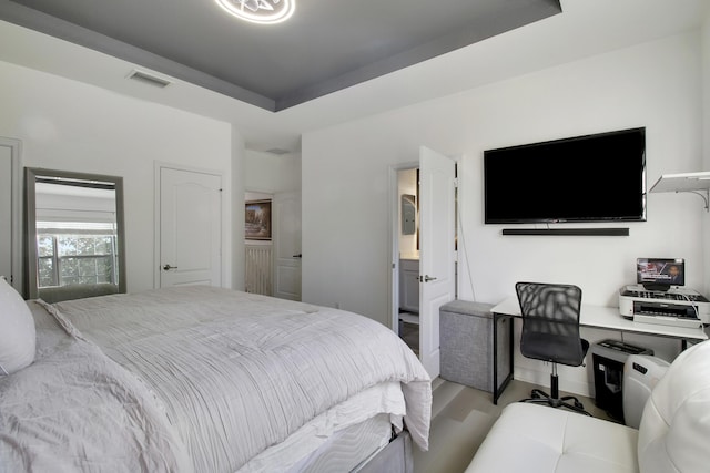 bedroom with a tray ceiling