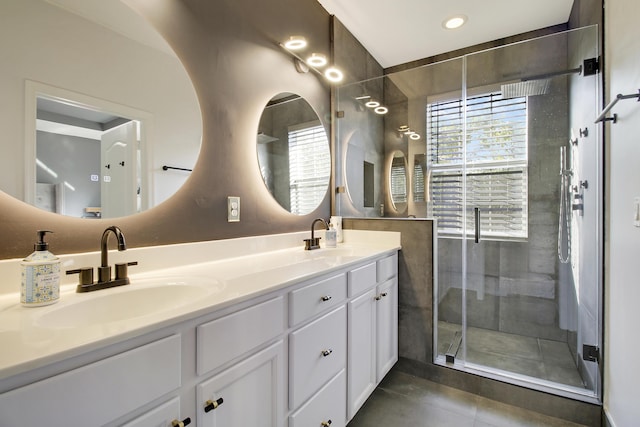 bathroom with walk in shower and vanity