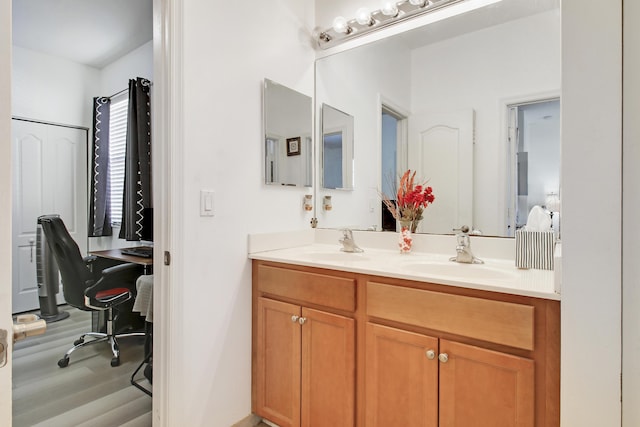 bathroom featuring vanity and hardwood / wood-style flooring