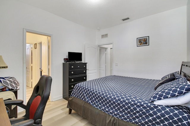 bedroom with light hardwood / wood-style floors