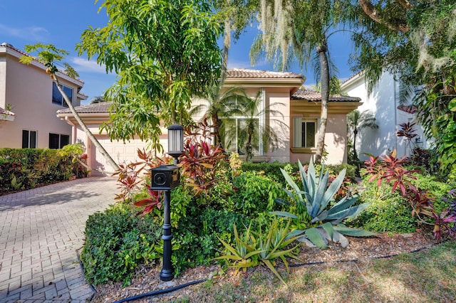 mediterranean / spanish-style house featuring a garage