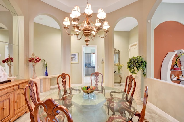 dining space featuring a chandelier