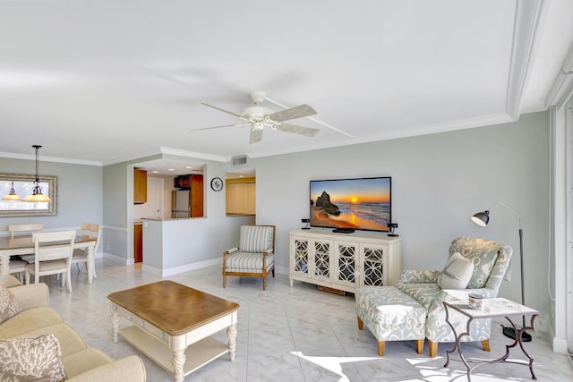 living room with ornamental molding and ceiling fan