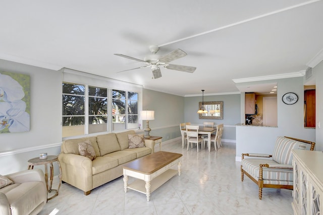 living room featuring ornamental molding and ceiling fan