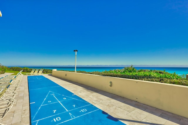 view of home's community with a water view