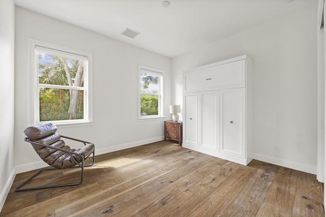 sitting room featuring light hardwood / wood-style floors