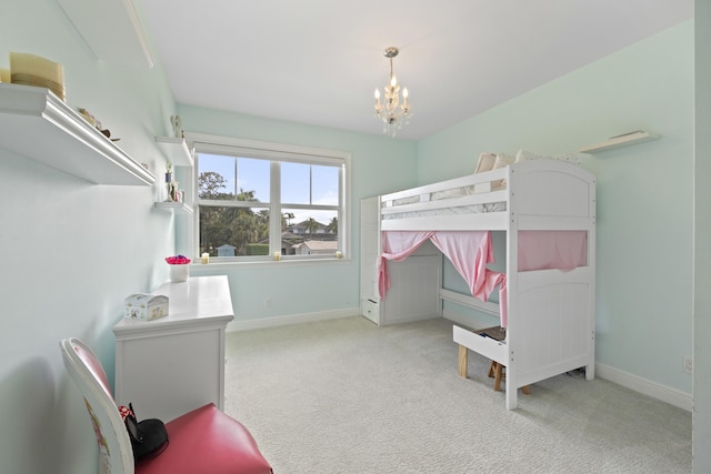 bedroom featuring light carpet and a chandelier