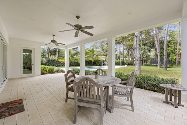 exterior space with a trampoline and ceiling fan