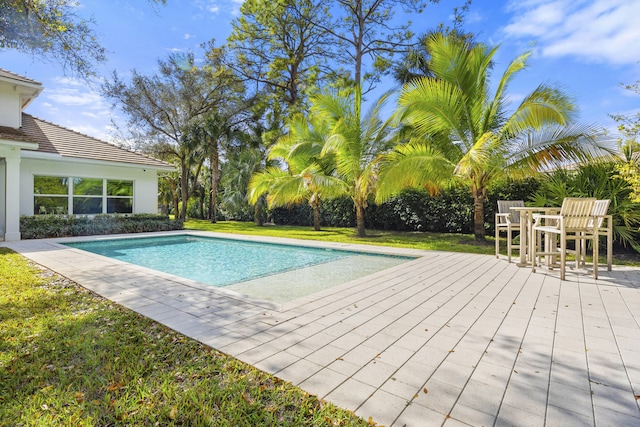 view of swimming pool with a wooden deck