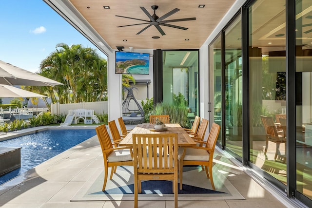 exterior space with outdoor dining area, a fenced in pool, ceiling fan, and fence