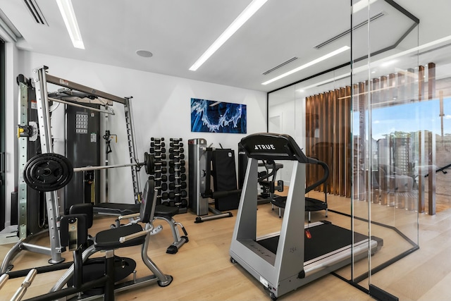 gym with visible vents and wood finished floors