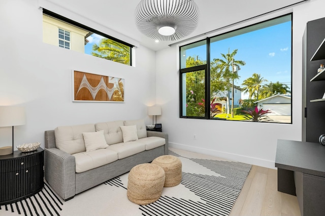 living area featuring wood finished floors and baseboards