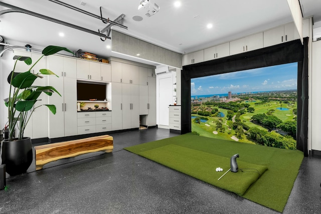 game room with golf simulator and an AC wall unit