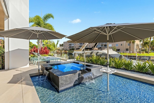 view of swimming pool featuring a pool with connected hot tub