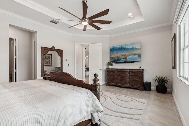 tiled bedroom featuring crown molding, ceiling fan, and a tray ceiling