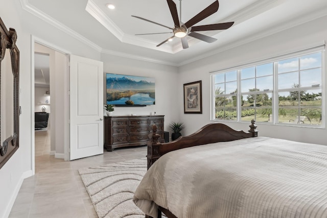 tiled bedroom featuring ornamental molding, a raised ceiling, and ceiling fan