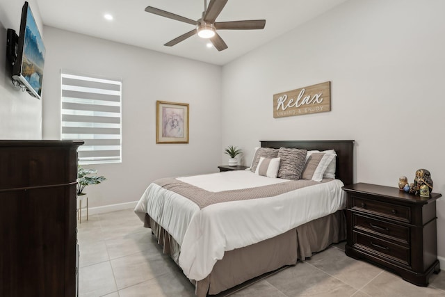 tiled bedroom featuring ceiling fan