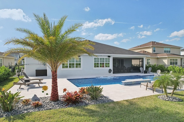 view of swimming pool featuring a hot tub and a patio