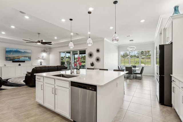 kitchen featuring sink, black refrigerator, stainless steel dishwasher, a kitchen island with sink, and white cabinets