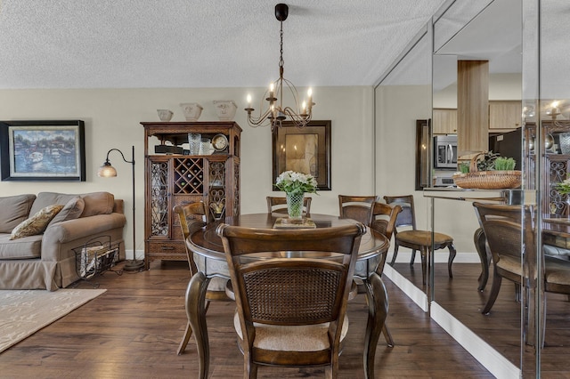 dining room with an inviting chandelier, dark hardwood / wood-style flooring, and a textured ceiling