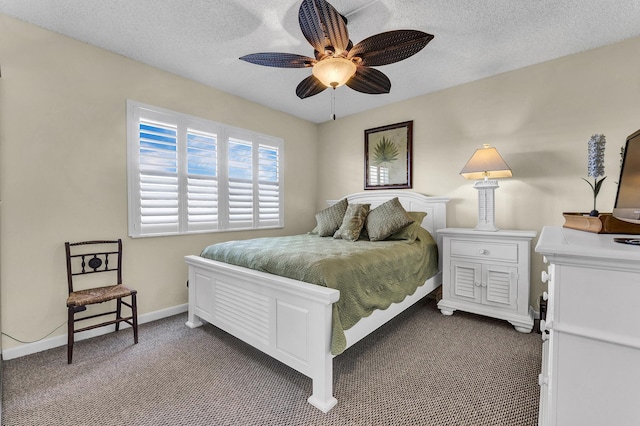 bedroom featuring ceiling fan, carpet, and a textured ceiling