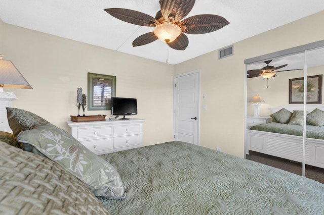 bedroom with dark carpet and ceiling fan