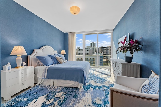 bedroom featuring a wall of windows