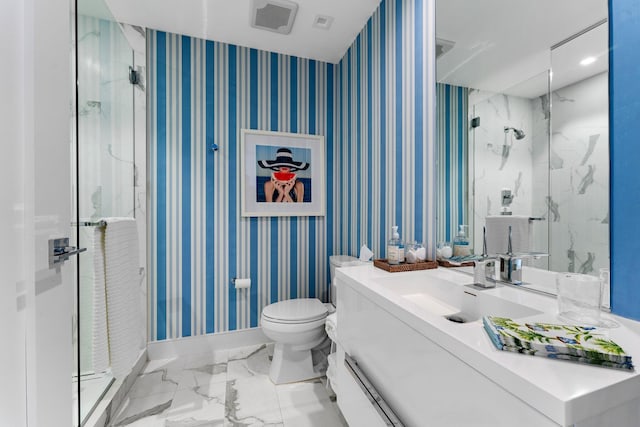 bathroom featuring vanity, toilet, and an enclosed shower