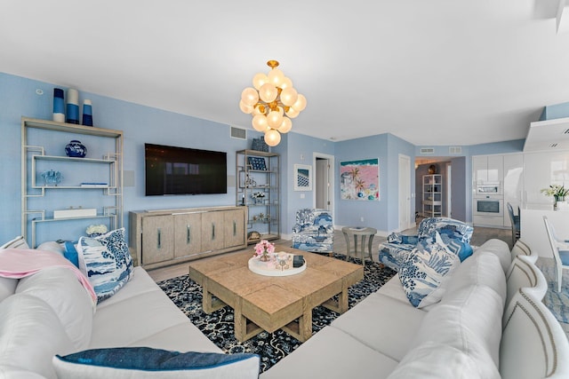 living room featuring a notable chandelier