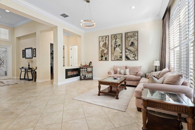 tiled living room with crown molding and a wealth of natural light