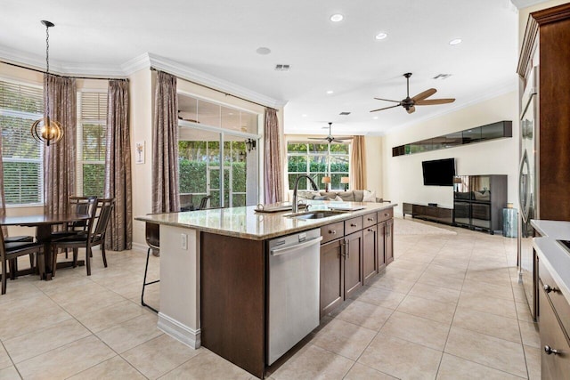 kitchen featuring sink, crown molding, a kitchen island with sink, hanging light fixtures, and stainless steel dishwasher