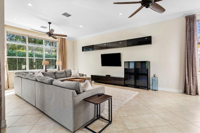 tiled living room with ornamental molding and ceiling fan