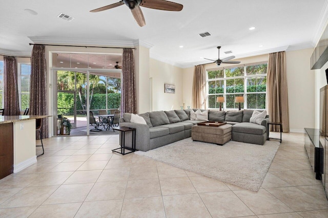 tiled living room featuring ornamental molding and ceiling fan