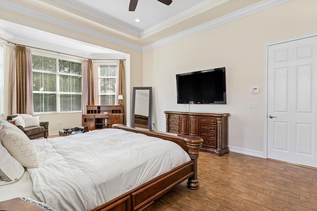 bedroom featuring crown molding, hardwood / wood-style flooring, and ceiling fan