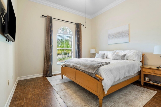 bedroom with dark wood-type flooring and crown molding