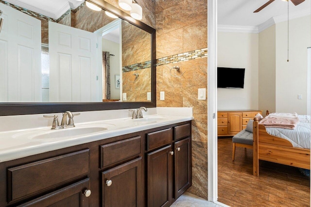 bathroom with vanity, crown molding, ceiling fan, and hardwood / wood-style flooring