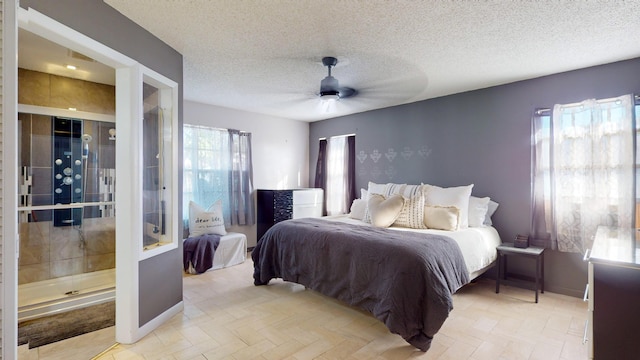 bedroom featuring ceiling fan and a textured ceiling