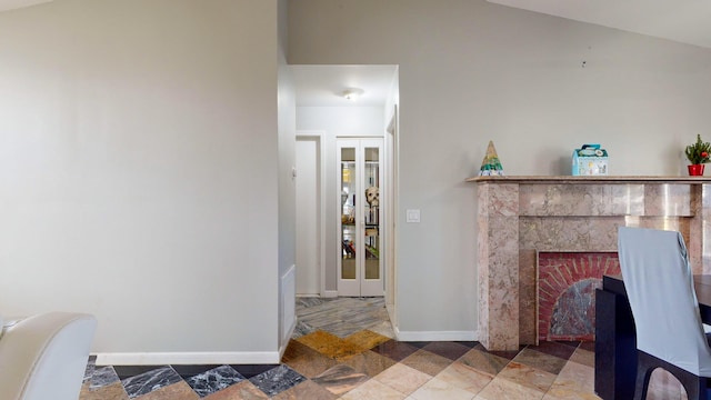 living room with a brick fireplace