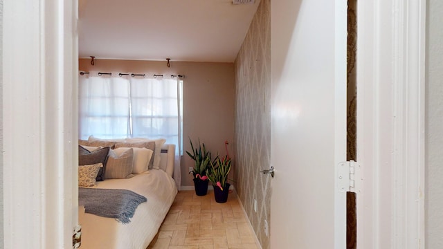 bedroom with light parquet flooring