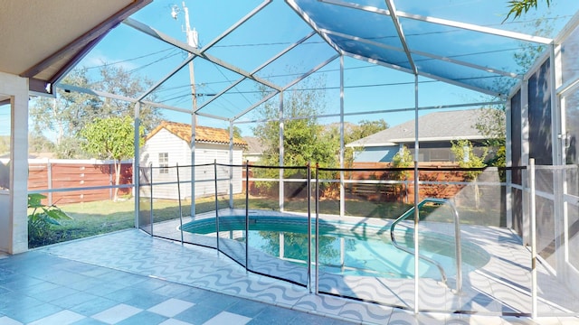 view of swimming pool with a lanai, a shed, and a patio