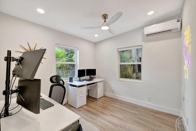 home office with an AC wall unit, recessed lighting, light wood-style floors, baseboards, and ceiling fan