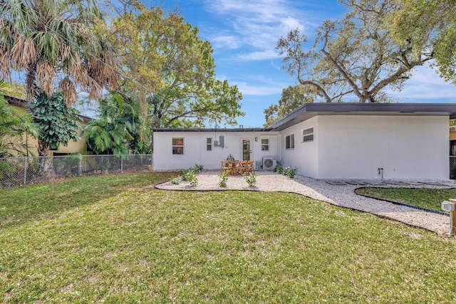 view of front of house featuring a patio, a front yard, fence, stucco siding, and ac unit