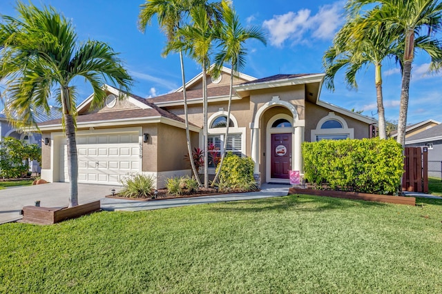 view of front of property featuring a garage and a front lawn