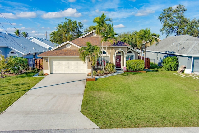 view of front of property featuring a garage and a front yard