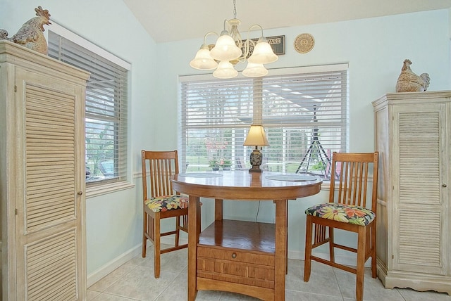 tiled dining space with plenty of natural light and a notable chandelier