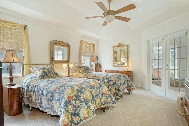 bedroom with crown molding, access to exterior, carpet flooring, a raised ceiling, and french doors