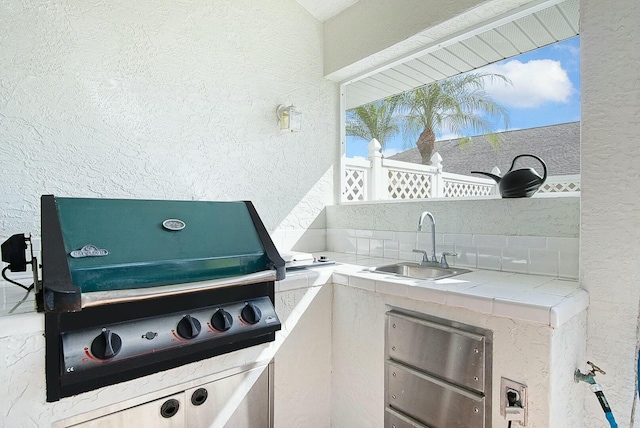 view of patio / terrace featuring sink and grilling area