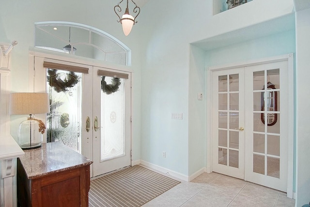 doorway featuring french doors and light tile patterned floors