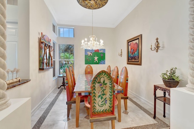 dining space featuring ornamental molding and a notable chandelier